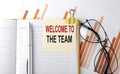 Text WELCOME TO THE TEAM on sticker on the notepad on diagram background Royalty Free Stock Photo