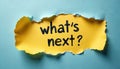 Text what next appears under torn paper. Concept of future decision forward vision. Idea represents planning change target Royalty Free Stock Photo