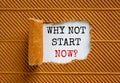 The text `why not start now` appearing behind torn brown paper. Beautiful background. Business concept Royalty Free Stock Photo