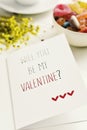 Text will you be my valentine in a postcard Royalty Free Stock Photo