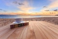 text wood block and coffee cup on wood table at sunset or sunrise beach