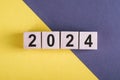 2024 text on wood cubes and yellow-gray background. New Year New Ideas, Creative, Innovation, Imagination, inspiration, Resolution Royalty Free Stock Photo