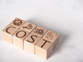 Text on wooden blocks as cost, expense or profit and loss concept