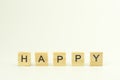 Text wooden blocks spelling the word HAPPY on white background Royalty Free Stock Photo