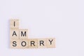 Text wooden blocks spelling the word i am sorry on white background Royalty Free Stock Photo