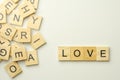 Text wooden blocks spelling the word LOVE on white background Royalty Free Stock Photo