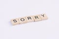 Text wooden blocks spelling the word sorry on white background Royalty Free Stock Photo