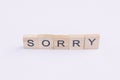 Text wooden blocks spelling the word sorry on white background Royalty Free Stock Photo