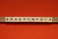 Text the word bradycardia from gray wooden small letters Royalty Free Stock Photo