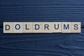 text the word doldrums from brown wooden small letters Royalty Free Stock Photo