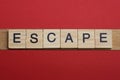 Text the word escape from gray wooden small letters