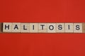Text the word halitosis from gray wooden small letters