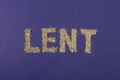 Text, word Lent made of ashes on purple background. Lent Season, Holy Week, Palm Sunday and Good Friday concept