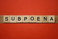 Text the word subpoena from gray wooden small letters