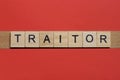 Text the word traitor from gray wooden small letters