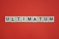 Text the word ultimatum from gray wooden small letters Royalty Free Stock Photo