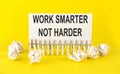 Text Work Smarter Not Harder on the white short note paper yellow background Royalty Free Stock Photo