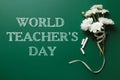 Text World Teacher`s Day, chalk and bouquet on greenboard. Greeting card design