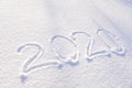 2020 text written on the background of fresh snow texture - winter holiday, Merry Christmas, New Year concept Sunny day, bright Royalty Free Stock Photo