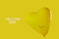 text yellow day and yellow heart-shaped balloon