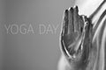 Text yoga day and the hand of Buddha