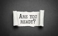 The text Are you ready appearing behind torn brown paper Royalty Free Stock Photo
