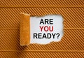 The text `are you ready` appearing behind torn brown paper. Beautiful background. Business concept Royalty Free Stock Photo