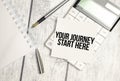 Text your journey start here on paper card and calculator on wooden background Royalty Free Stock Photo