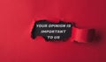 text Your opinion is important to us on a black background with red torn paper Royalty Free Stock Photo