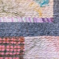 Various sewn pieces of patchwork cloth