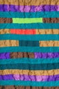 Stitched patchwork scarf from many narrow bands Royalty Free Stock Photo