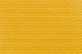 Textile background, yellow with a print in white polka dots. Royalty Free Stock Photo