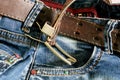 Textile: blue jeans with a brown leather belt Royalty Free Stock Photo
