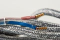 Textile braided electrical cable cord with terminals