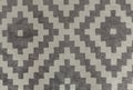 Textile carpet. Black and white soft rug in moroccan style. Abstract texture background with diamond geometric pattern. Royalty Free Stock Photo