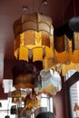 A textile chandelier shining by yellow light.