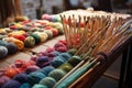 textile crafts workshop, with rows of knitting needles and colorful yarn