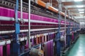 Textile factory with machines weaving colorful fabric, showcasing the production process of clothing Royalty Free Stock Photo