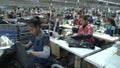 Textile Garment Factory Workers: Dolly type move along aisles of workers