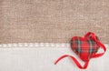 Textile heart, ribbon and linen cloth on the burlap Royalty Free Stock Photo