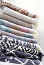 Textile industrial background with fabric texture, variation of multicolored soft cotton rugs and warm blankets stacked Royalty Free Stock Photo