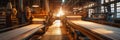 A textile mill with rows of looms weaving intricate patterns, surrounded by the warm glow of task lighting