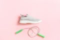 Textile sport shoes with jumping skipping rope on pink