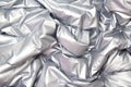 Textile and texture concept - close up of crumpled gray silver metallic fabric background Royalty Free Stock Photo