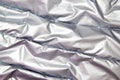 Textile and texture concept - close up of crumpled gray silver metallic fabric background Royalty Free Stock Photo