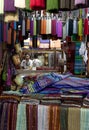 A textile weaver at work in the Fez medina, Morocco.