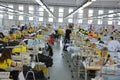 Textile workers behind their workplaces