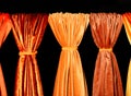 Textiles of various orange shades, technology, style and beauty concept in the interior Royalty Free Stock Photo