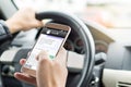 Texting while driving car. Irresponsible man sending sms. Royalty Free Stock Photo