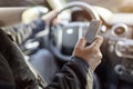 Texting while driving using cell phone in car Royalty Free Stock Photo